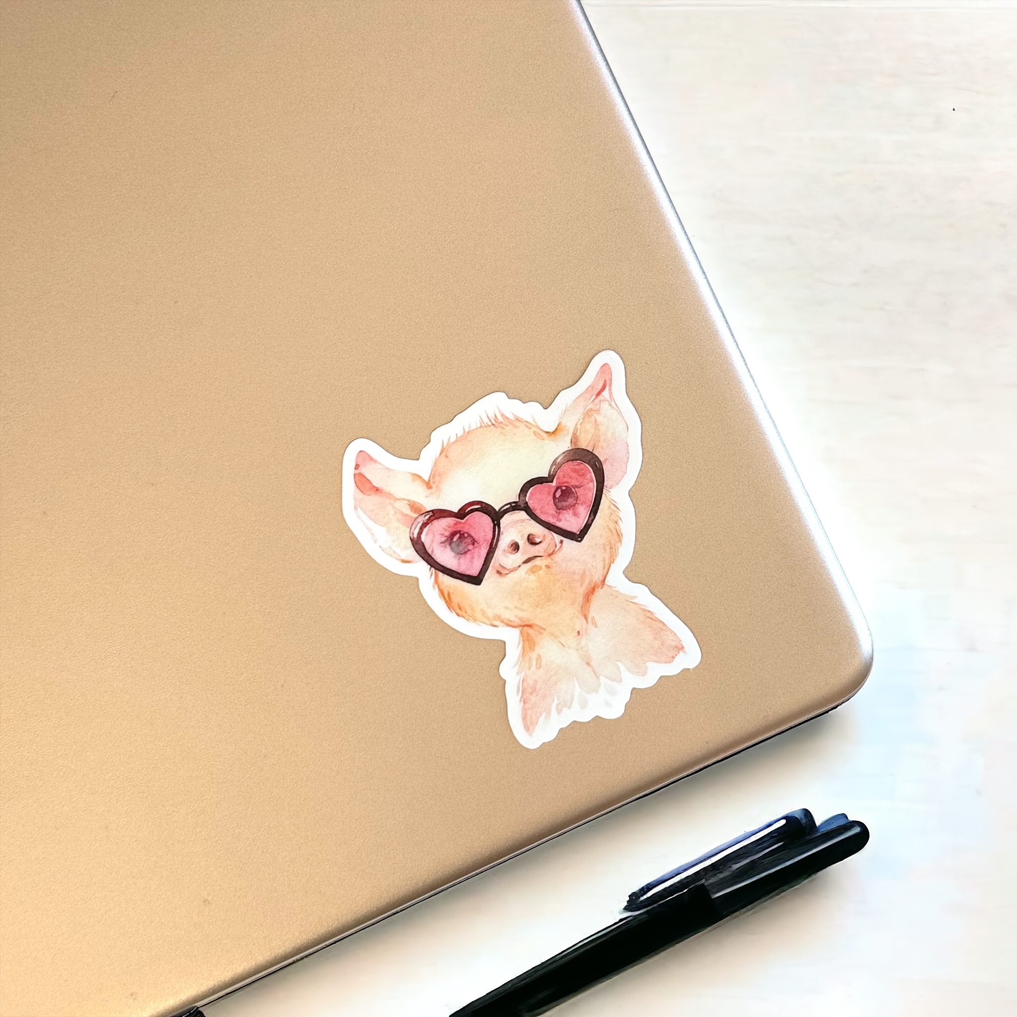pig in sunglasses sticker on laptop lid